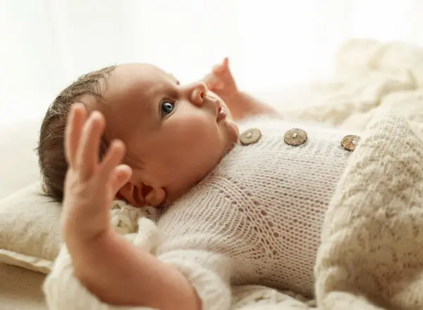Newborn photography Monsey NY – Newborn baby in a cream knit outfit